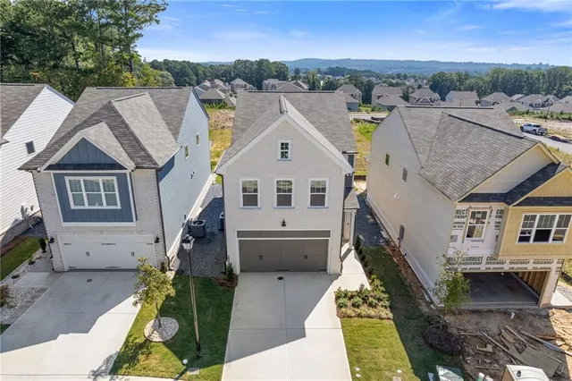 a view of house and yard with green space