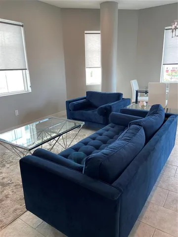 a living room with furniture and a window