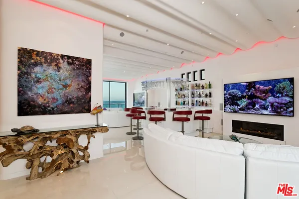 a dining room with furniture and chandelier