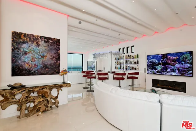 a dining room with furniture and chandelier