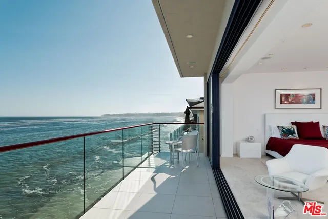 a kitchen with a refrigerator and a stove