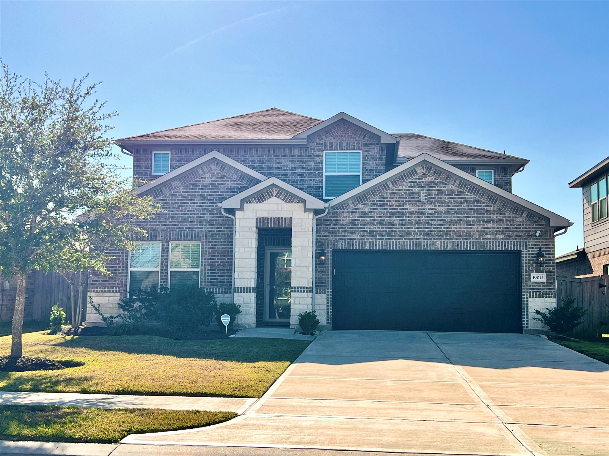 10013 Hermann Trace Texas City, TX 77591 - Photo 1 of 22 a front view of a house with garden