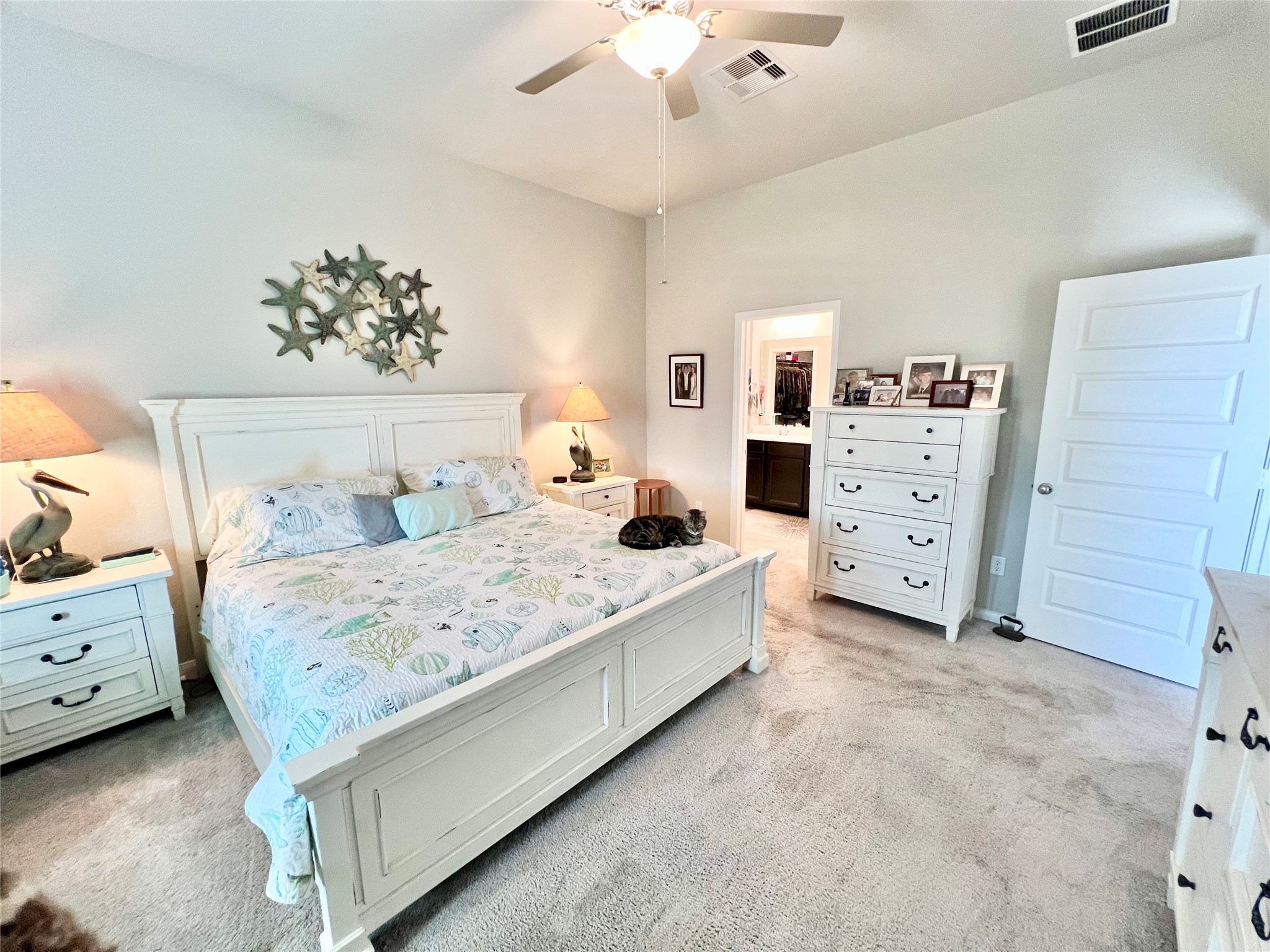10013 Hermann Trace Texas City, TX 77591 - Photo 12 of 22 a bedroom with a large bed and a dresser