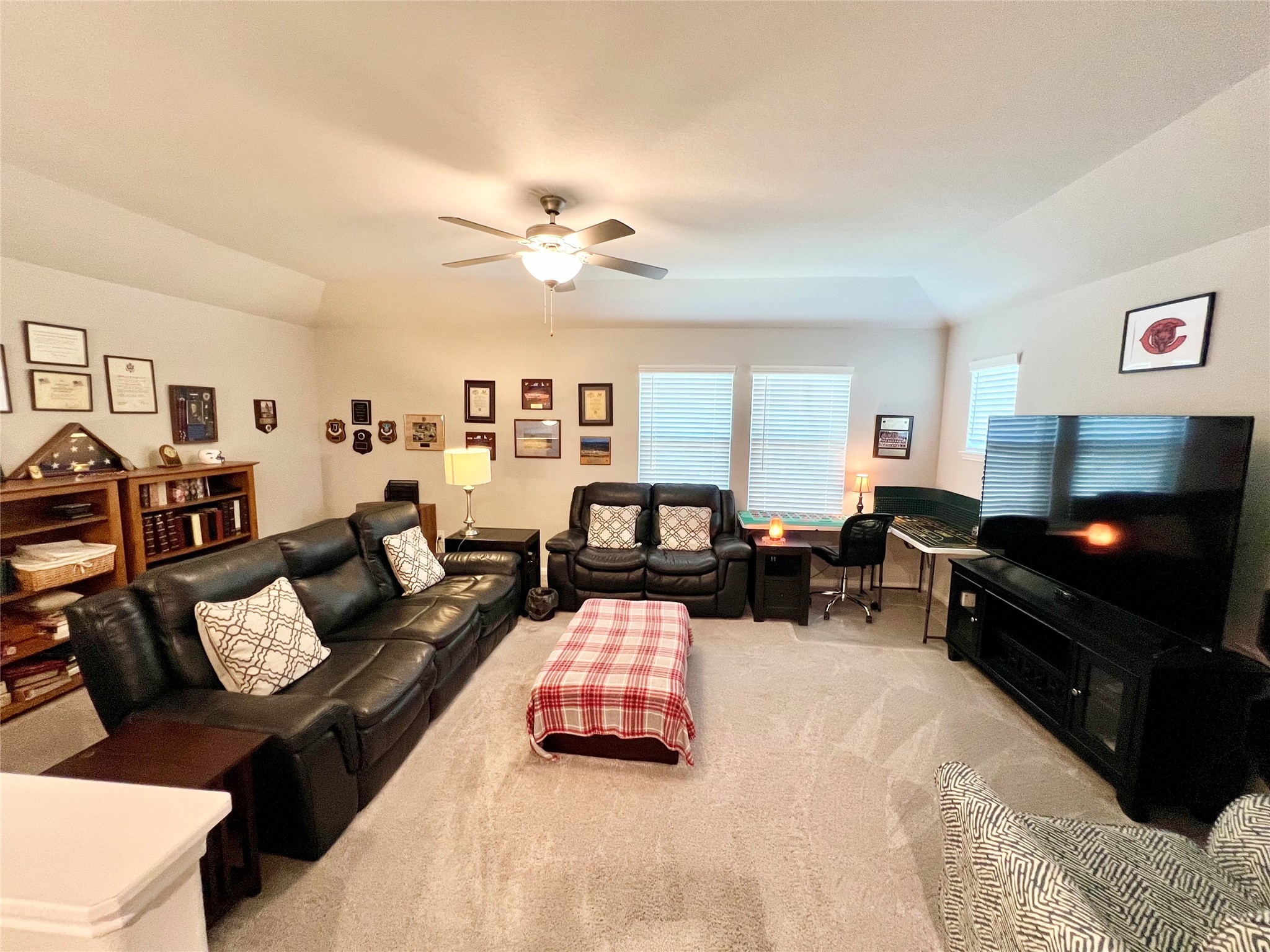10013 Hermann Trace Texas City, TX 77591 - Photo 13 of 22 a living room with furniture and a flat screen tv