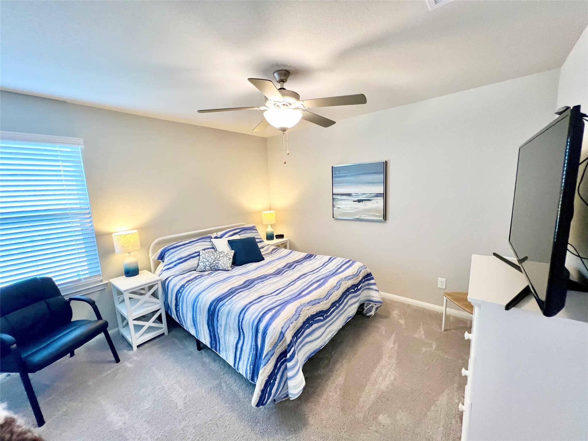 10013 Hermann Trace Texas City, TX 77591 - Photo 15 of 22 a bedroom with bed and a window