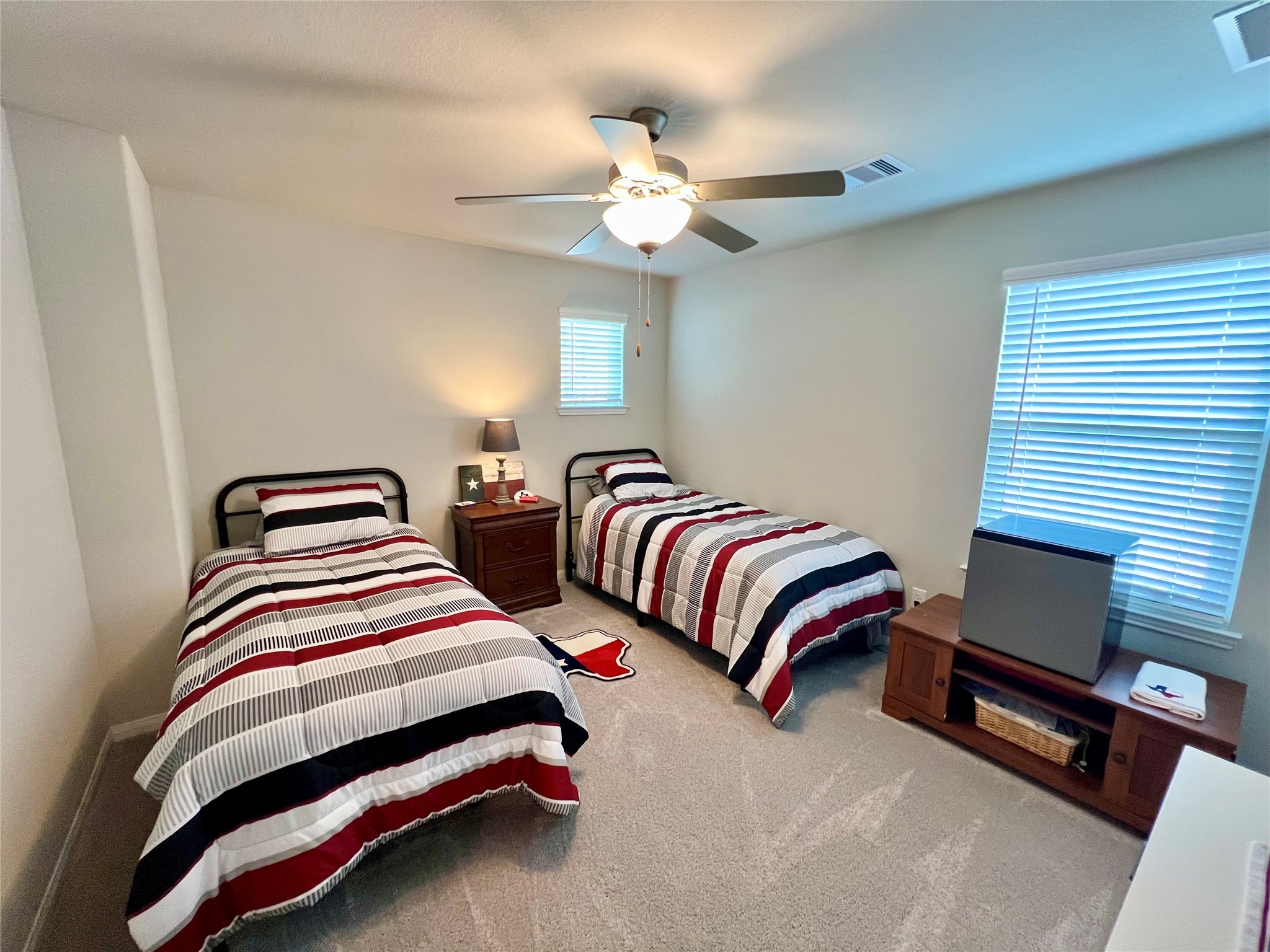 10013 Hermann Trace Texas City, TX 77591 - Photo 17 of 22 a bedroom with bed and a chandelier