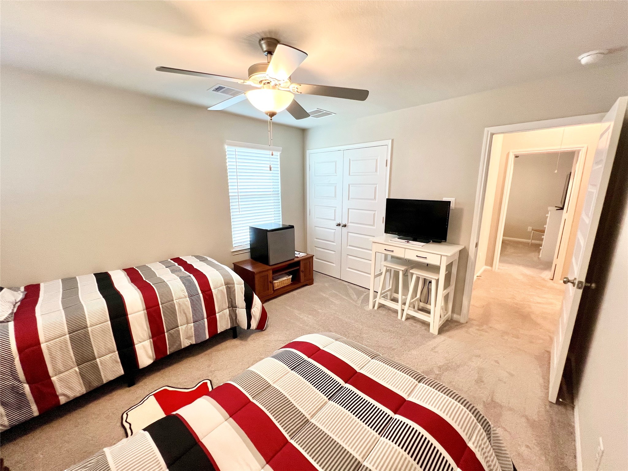 10013 Hermann Trace Texas City, TX 77591 - Photo 18 of 22 a bedroom with a bed and flat screen tv