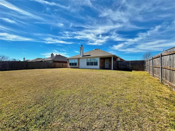a house with yard in front of it