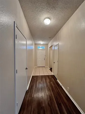 a view of gallery with wooden floor