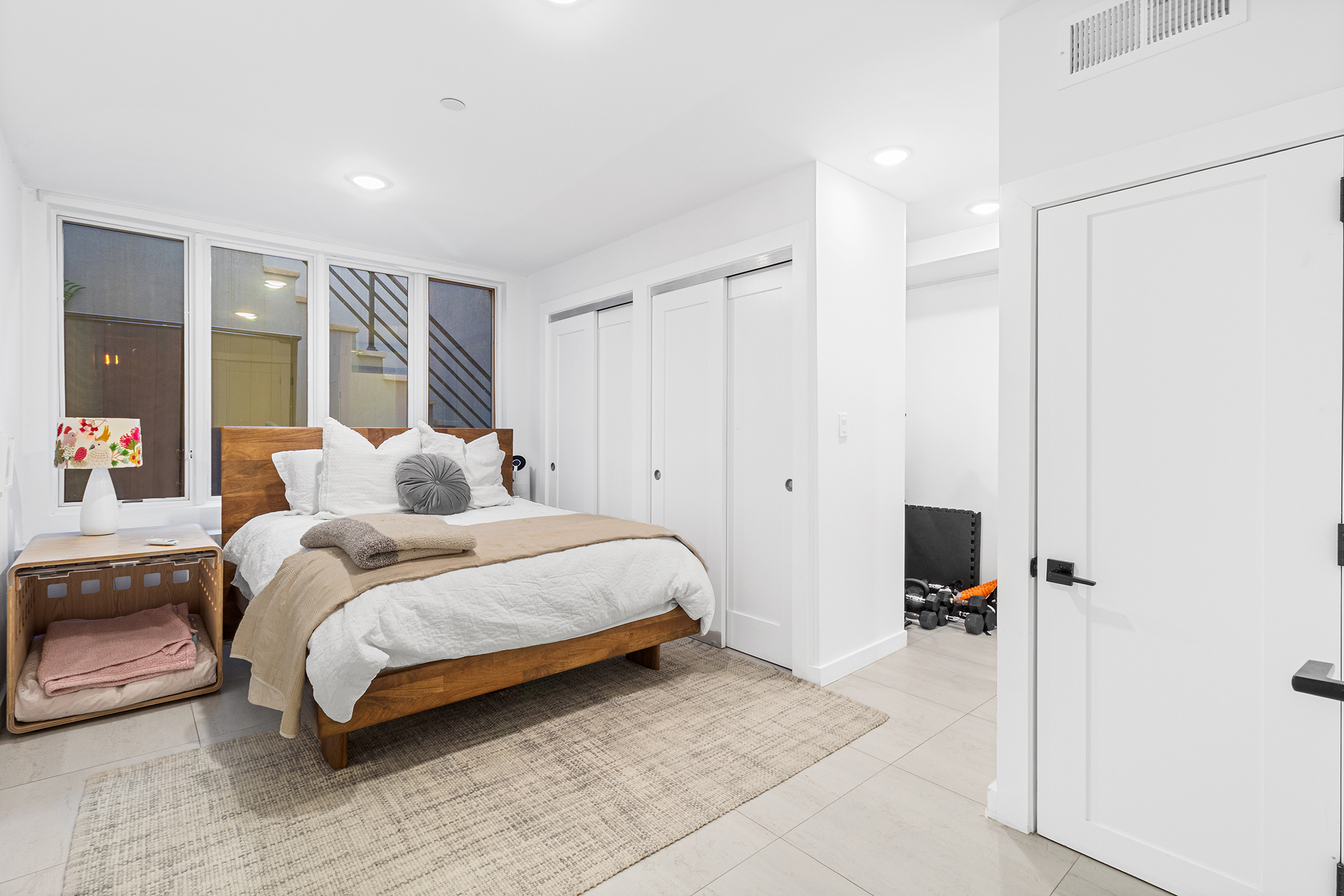 31 Bleecker Street, Unit 1R Brooklyn, NY 11221 - Photo 13 of 19 a bedroom with a bed and a large window