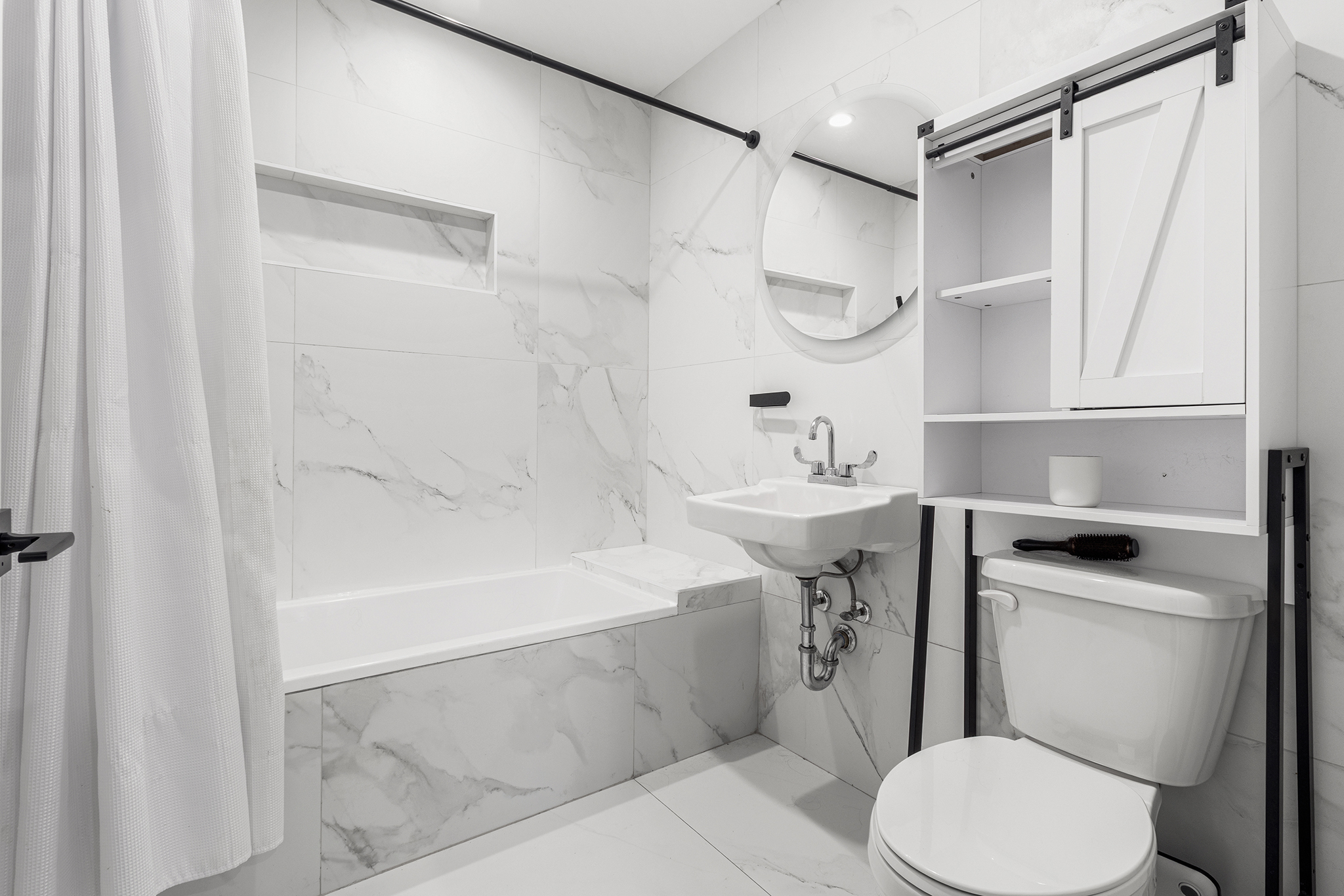 31 Bleecker Street, Unit 1R Brooklyn, NY 11221 - Photo 16 of 19 a bathroom with a sink toilet and shower