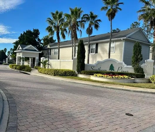 a front view of a house with a garden and patio