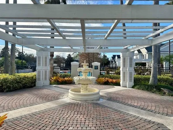 a view of a patio with dining table and chairs