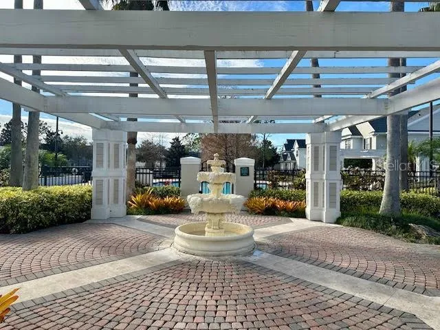 a view of a patio with dining table and chairs