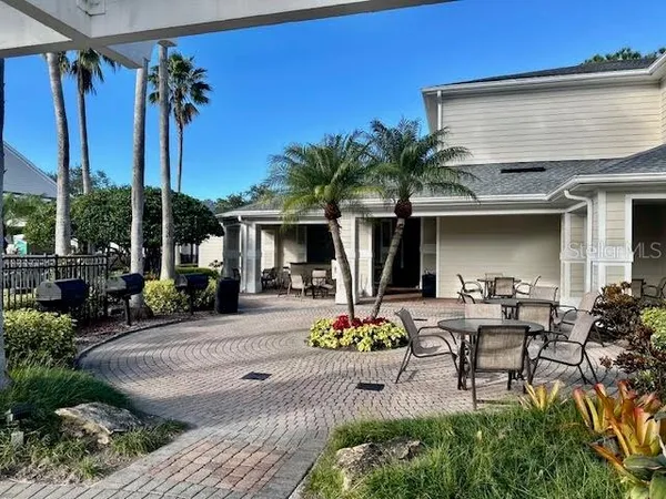 a view of a dinning table and chairs in patio