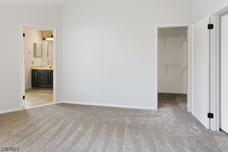 93 Birchwood Road Bedminster, NJ 07921 - Photo 11 of 18 a view of an empty room with window and a bathroom with sink