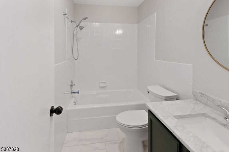 93 Birchwood Road Bedminster, NJ 07921 - Photo 14 of 18 a bathroom with a granite countertop sink toilet and shower