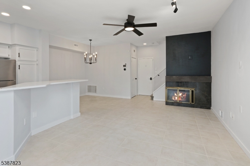 93 Birchwood Road Bedminster, NJ 07921 - Photo 7 of 18 a view of an empty room with a fireplace
