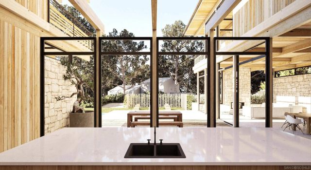 a room with a large window and a couch