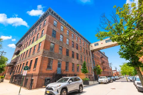 a view of a chairs and tables in a patio