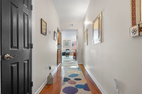 a kitchen with stainless steel appliances granite countertop a refrigerator stove and sink