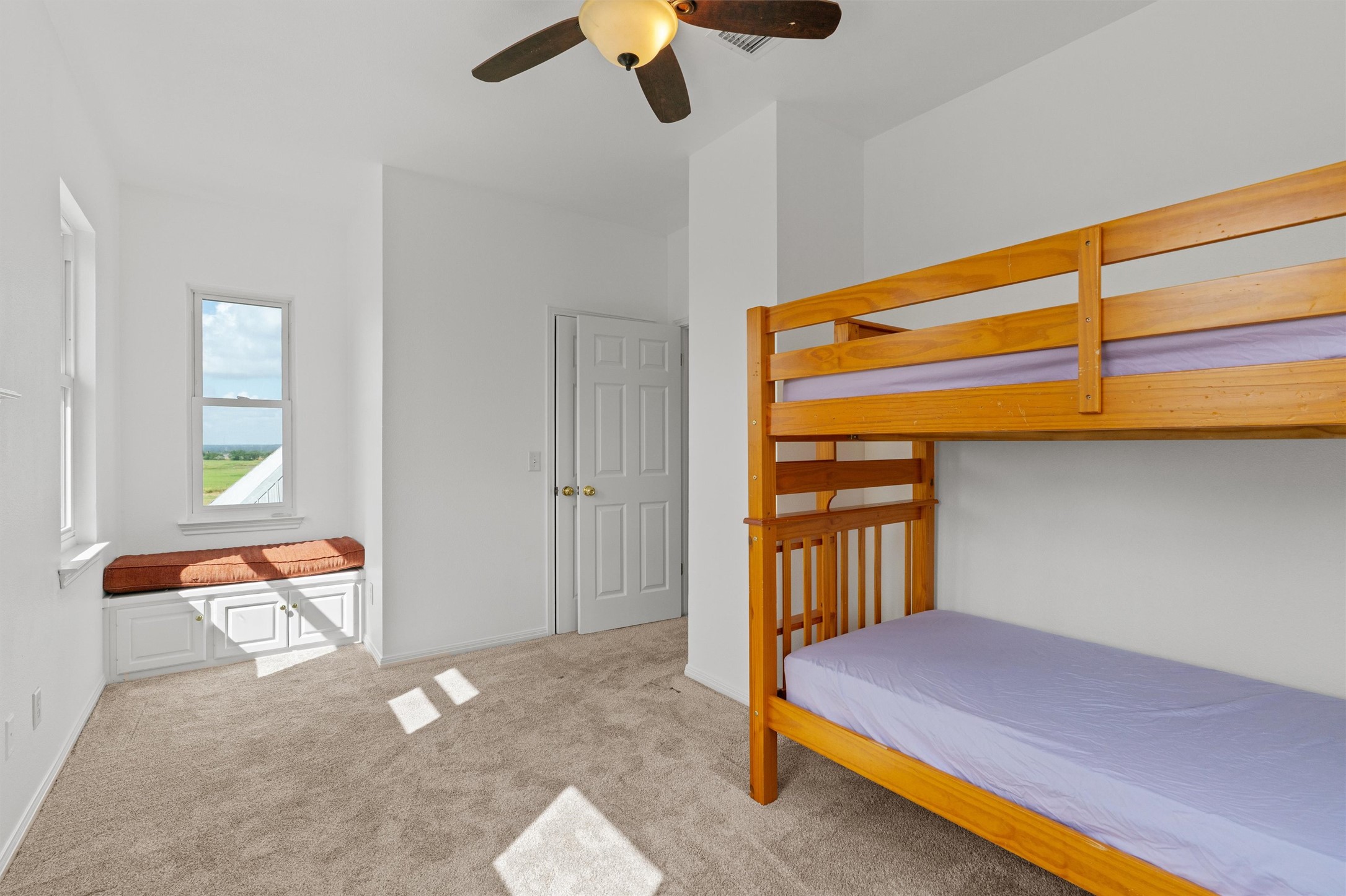 768 Upper Elgin River Road Elgin, TX 78621 - Photo 28 of 40 Bedroom #3 with window bench and storage