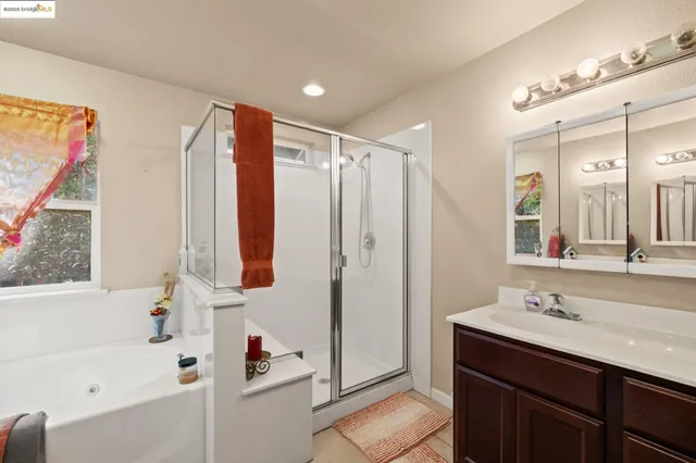 a view of a kitchen with furniture and windows