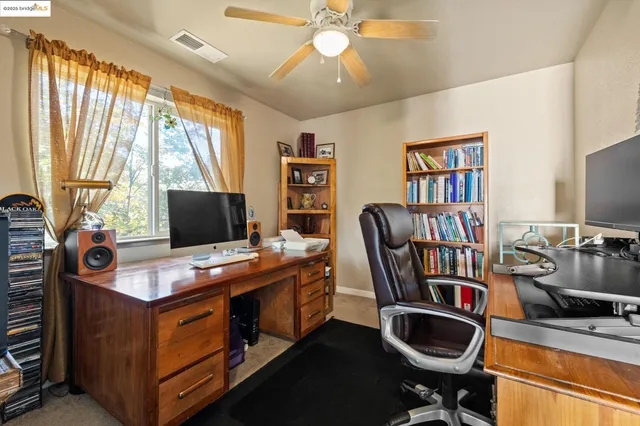 a room with furniture and a flat screen tv