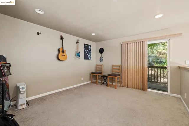 a view of a house with a tree and a yard
