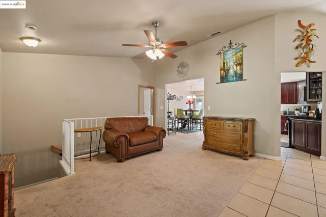 a kitchen with stainless steel appliances granite countertop a refrigerator a stove a sink and a microwave