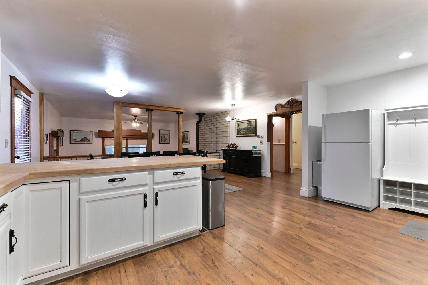 5276 Highway 4 Murphys, CA 95247 - Photo 11 of 69 a kitchen with white cabinets and stainless steel appliances