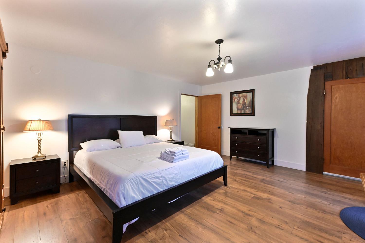 5276 Highway 4 Murphys, CA 95247 - Photo 22 of 69 a bedroom with a bed and a fireplace