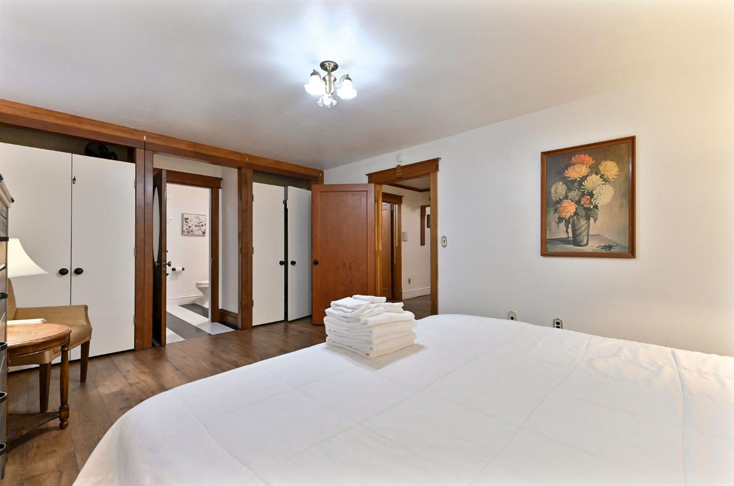 5276 Highway 4 Murphys, CA 95247 - Photo 26 of 69 a bedroom with a large bed and a chandelier