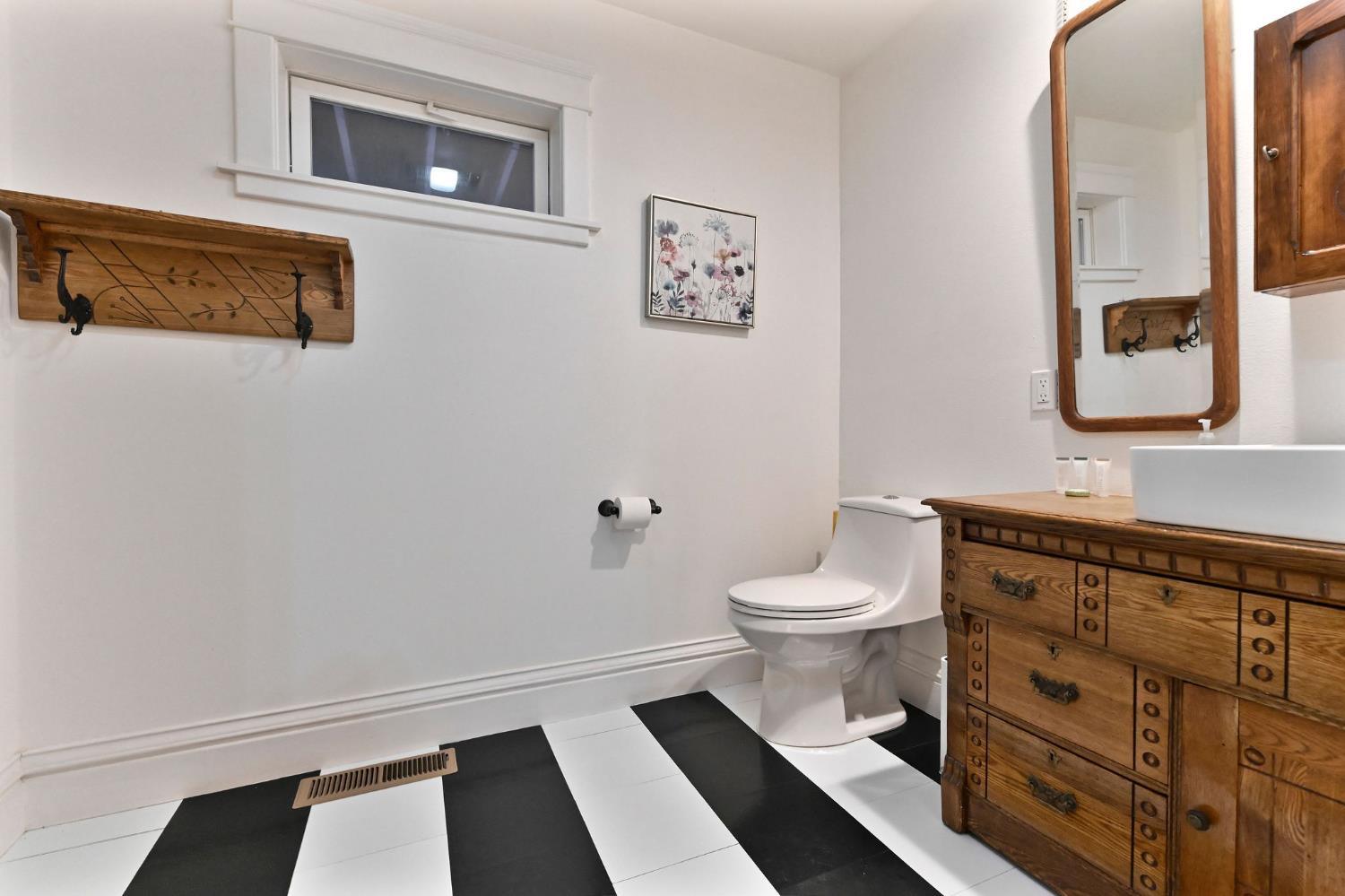 5276 Highway 4 Murphys, CA 95247 - Photo 27 of 69 a bathroom with a toilet a sink and mirror