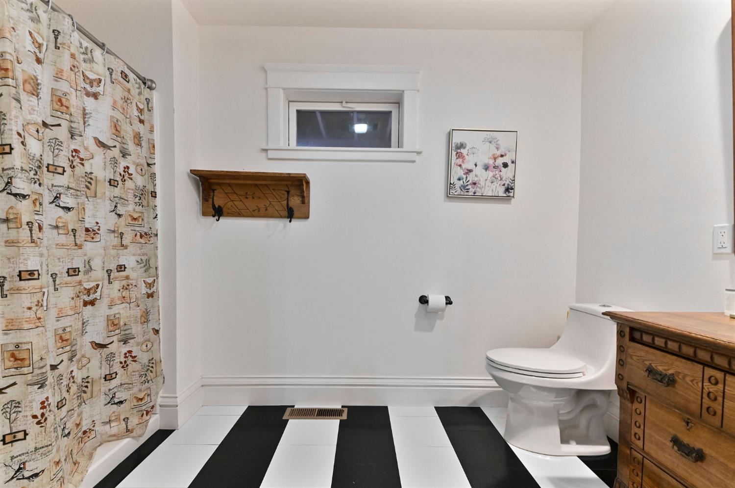5276 Highway 4 Murphys, CA 95247 - Photo 29 of 69 a bathroom with a toilet and a shower curtain