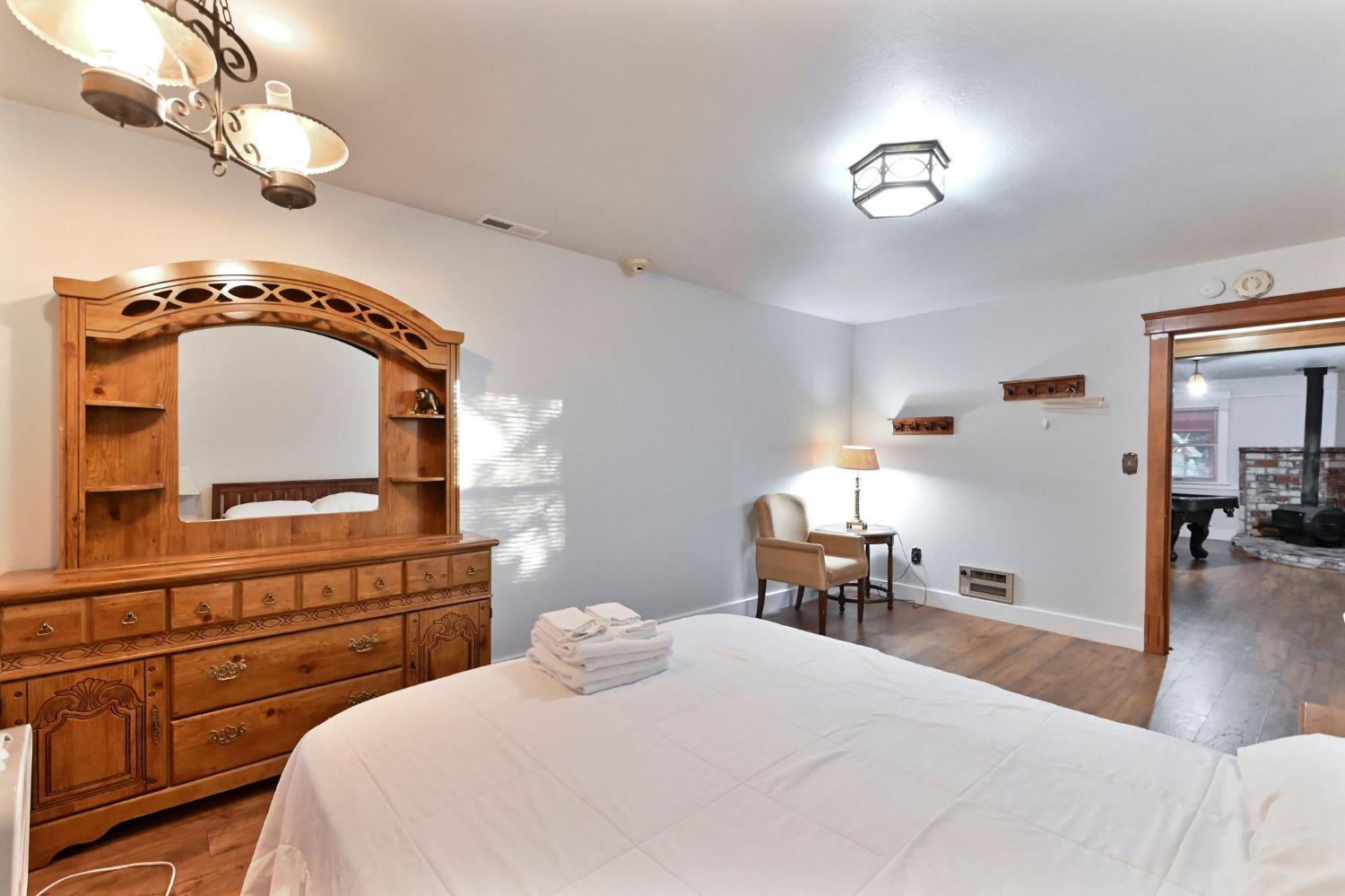 5276 Highway 4 Murphys, CA 95247 - Photo 36 of 69 a bedroom with a bed and a chair