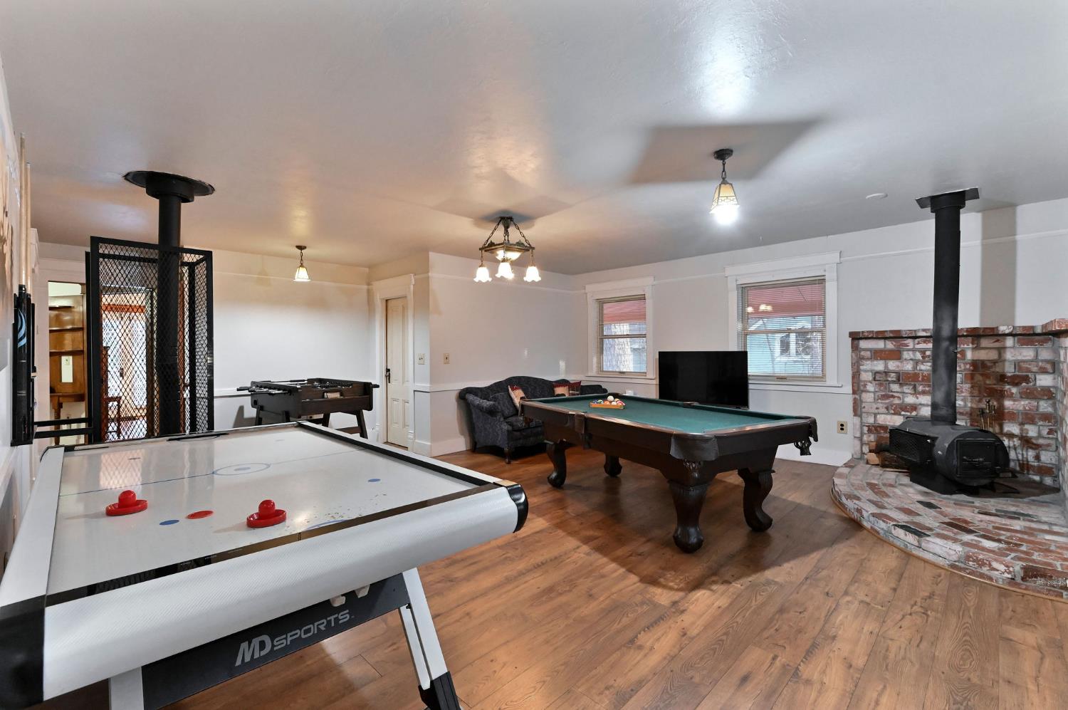 5276 Highway 4 Murphys, CA 95247 - Photo 38 of 69 a room with furniture pool table gym equipment and a flat screen tv