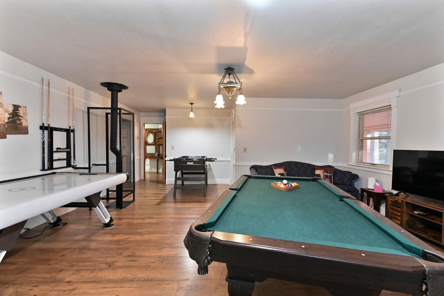 5276 Highway 4 Murphys, CA 95247 - Photo 39 of 69 a room with furniture pool table flat screen tv and windows