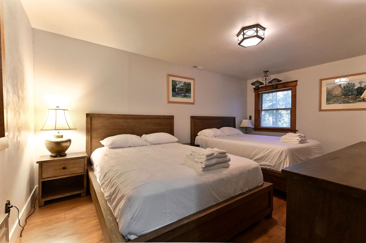5276 Highway 4 Murphys, CA 95247 - Photo 44 of 69 a bedroom with two beds and a dresser