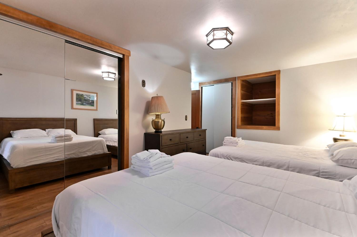 5276 Highway 4 Murphys, CA 95247 - Photo 46 of 69 a bedroom with two beds and a lamp