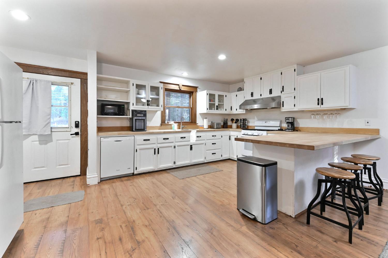 5276 Highway 4 Murphys, CA 95247 - Photo 7 of 69 a kitchen with stainless steel appliances a sink a stove a refrigerator cabinets and a dining table