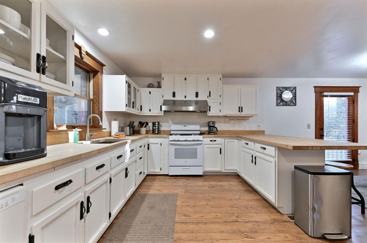 5276 Highway 4 Murphys, CA 95247 - Photo 8 of 69 a large kitchen with stainless steel appliances granite countertop a lot of counter space and wooden floors