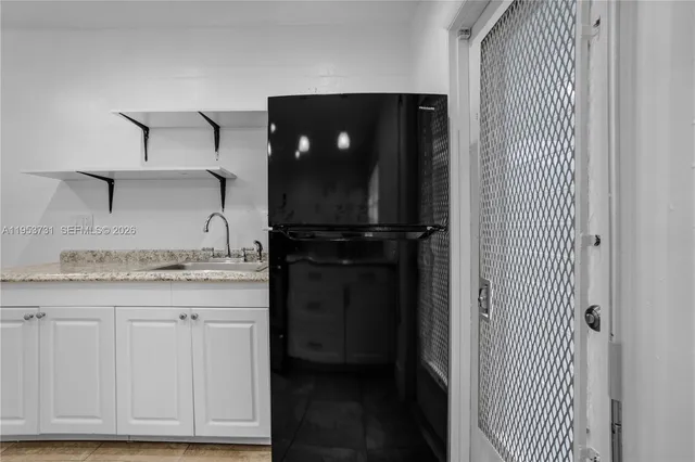 a view of cabinets and wooden floor
