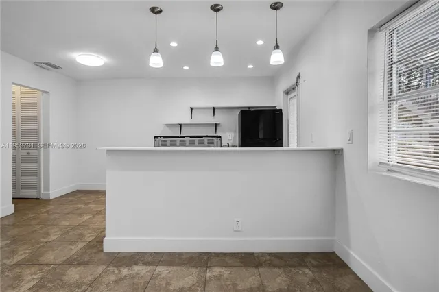 a view of a kitchen with a sink and dishwasher