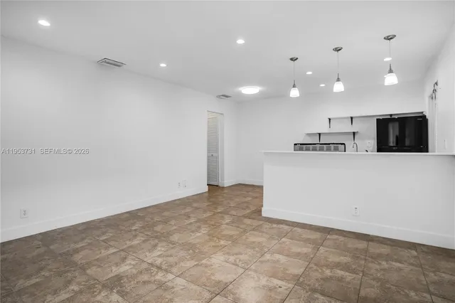 a view of counter top space with stainless steel appliances