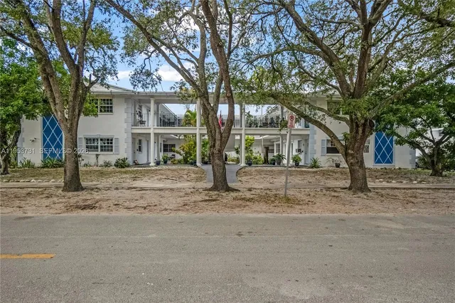 front view of a house with a trees