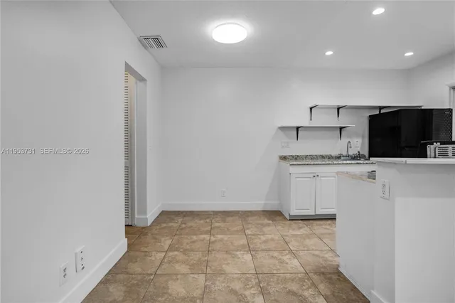 a view of a kitchen with a sink