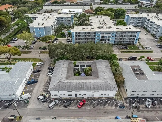 an aerial view of a house with outdoor space