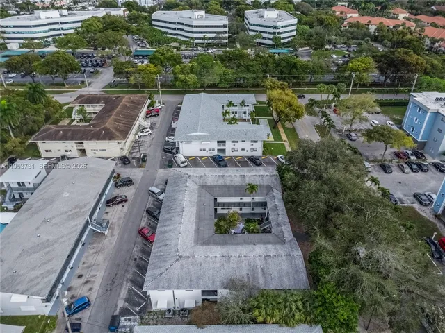 an aerial view of a house with outdoor space
