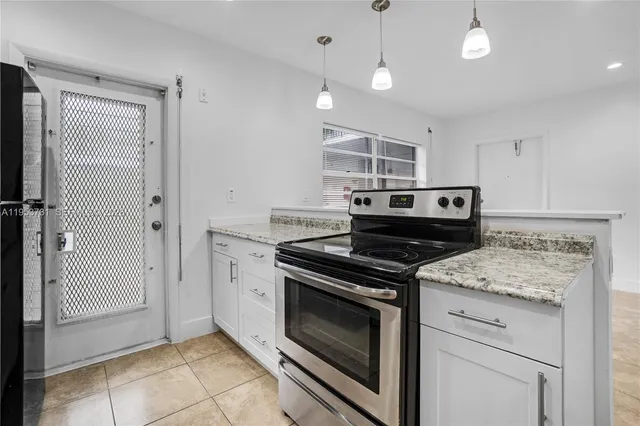 a kitchen with a stove and a sink